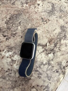 Silver Apple Watch Series 4 with Navy Blue Band